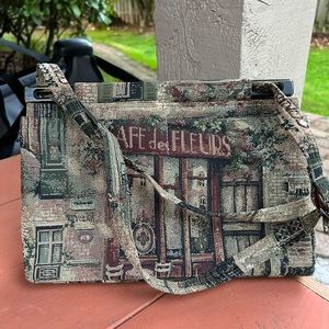 Toby Weston tapestry bag (Paris) 8” by 11”. Floral lining. Adjustable strap